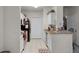 Functional kitchen featuring white cabinetry, granite countertops, and stainless steel appliances at 304 Southern Pecan Cir # 105, Winter Garden, FL 34787