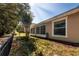 View of a fenced-in backyard with lawn and landscaping at 30546 Lipizzan Ter, Mount Dora, FL 32757