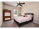 Bright bedroom featuring neutral decor, ceiling fan, and a comfortable bed at 30546 Lipizzan Ter, Mount Dora, FL 32757