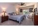 Comfortable bedroom featuring a ceiling fan, natural light, and neutral decor at 30546 Lipizzan Ter, Mount Dora, FL 32757
