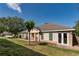Well-maintained home with manicured lawn, beige siding and french doors at 30546 Lipizzan Ter, Mount Dora, FL 32757