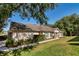 Beautiful home with well-maintained lawn, manicured landscaping, and sidewalk leading to the entrance at 30546 Lipizzan Ter, Mount Dora, FL 32757