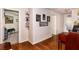 Hallway with hardwood floors, artwork, and doors leading to other rooms at 30546 Lipizzan Ter, Mount Dora, FL 32757