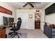 Home office with comfortable seating, a ceiling fan, a closet, and a view of the dining room at 30546 Lipizzan Ter, Mount Dora, FL 32757