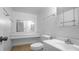 Bathroom featuring tile flooring, a vanity, sink, toilet, and a large mirror at 316 Scottsdale Sq # 316, Winter Park, FL 32792