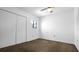 Bedroom featuring carpet, a ceiling fan, a window, and a large closet at 316 Scottsdale Sq # 316, Winter Park, FL 32792