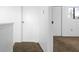 Bright hallway leads to the bedroom, featuring carpeted flooring and an abundance of storage space at 316 Scottsdale Sq # 316, Winter Park, FL 32792