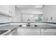 Open kitchen layout featuring essential appliances and serving hatch, perfect for entertaining guests at 316 Scottsdale Sq # 316, Winter Park, FL 32792