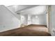 Bright living room featuring a staircase, views to the kitchen, and access to the private patio at 316 Scottsdale Sq # 316, Winter Park, FL 32792