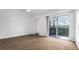 Large main bedroom features sliding glass doors to the balcony and a spacious closet at 316 Scottsdale Sq # 316, Winter Park, FL 32792