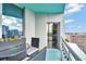 Relaxing balcony showcases an outdoor dining set and stunning panoramic city vistas at 322 E Central Blvd # 1909, Orlando, FL 32801