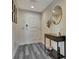 Well-decorated entryway with modern console table, wood-look flooring, and stylish accents at 322 E Central Blvd # 1909, Orlando, FL 32801