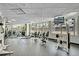 Well-equipped fitness center with weight machines, dumbbells, and natural light at 322 E Central Blvd # 1909, Orlando, FL 32801