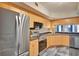 Contemporary kitchen with stainless appliances, and ample cabinet space with a view to the living and dining area at 322 E Central Blvd # 1909, Orlando, FL 32801
