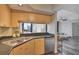 Well-appointed kitchen features modern appliances, countertops with breakfast bar, and an open view to the living area at 322 E Central Blvd # 1909, Orlando, FL 32801
