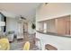 Bright living room boasts hardwood floors, comfortable seating, and a pass-through to the kitchen and dining area at 322 E Central Blvd # 1909, Orlando, FL 32801