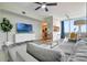 Modern living room with hardwood floors, a ceiling fan, and neutral decor at 322 E Central Blvd # 1909, Orlando, FL 32801