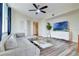 Contemporary living room with a comfortable gray sectional, a glass coffee table, and wood-look floors at 322 E Central Blvd # 1909, Orlando, FL 32801