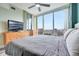 Relaxing main bedroom offering large windows with a stunning cityscape view at 322 E Central Blvd # 1909, Orlando, FL 32801