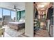 Bright main bedroom with a walk-in closet featuring custom shelving and ample storage at 322 E Central Blvd # 1909, Orlando, FL 32801