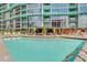 Beautiful pool area features ample seating and a serene environment near the main building at 322 E Central Blvd # 1909, Orlando, FL 32801