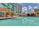 Inviting swimming pool area with lounge chairs and a covered cabana for relaxation at 322 E Central Blvd # 1909, Orlando, FL 32801