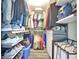 Organized walk-in closet with custom shelving and plenty of storage space for clothes and shoes at 322 E Central Blvd # 1909, Orlando, FL 32801