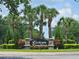 Victoria Landings entrance sign with palm trees and well-maintained landscaping at 3506 Creswick Cir, Orlando, FL 32829