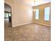 Elegant dining room featuring stylish chandelier lighting and tiled flooring at 3506 Creswick Cir, Orlando, FL 32829