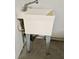 Laundry sink with silver metal legs in unfinished space at 3506 Creswick Cir, Orlando, FL 32829