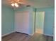 Bright bedroom featuring ceiling fan and closet at 3586 Eversholt St, Clermont, FL 34711