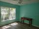 Bedroom featuring light-filled large window and ceiling fan at 3586 Eversholt St, Clermont, FL 34711