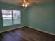Light-filled bedroom with large window offering a bright view at 3586 Eversholt St, Clermont, FL 34711