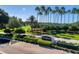 Kings Ridge entry sign surrounded by lush landscaping, tall palms and green lawns at 3586 Eversholt St, Clermont, FL 34711
