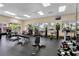 Exercise room featuring various workout machines, free weights and views of the community at 3586 Eversholt St, Clermont, FL 34711