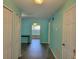 Bright hallway with wood-look flooring and a view to the living spaces at 3586 Eversholt St, Clermont, FL 34711