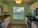 Well-lit kitchen featuring matching appliances and view from kitchen window at 3586 Eversholt St, Clermont, FL 34711
