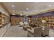 Inviting library featuring shelves of books, comfortable seating, and soft lighting at 3586 Eversholt St, Clermont, FL 34711