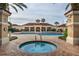 View of the community pool, hot tub, and clubhouse, creating an inviting outdoor oasis at 3586 Eversholt St, Clermont, FL 34711