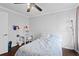 Cozy bedroom features crown molding, a desk area, and a comfortable bed at 408 S Winsome Ct, Lake Mary, FL 32746