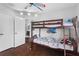 A bedroom features hardwood floors and a charming bunk bed set for children at 408 S Winsome Ct, Lake Mary, FL 32746