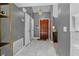 Inviting home entryway featuring tile floors, chandelier, and wooden door at 408 S Winsome Ct, Lake Mary, FL 32746