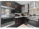 Modern kitchen featuring stainless steel appliances, dark wood cabinets, and stylish backsplash at 408 S Winsome Ct, Lake Mary, FL 32746
