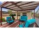 Relaxing outdoor space with stylish blue cushioned seating and a pergola overhead, perfect for entertaining at 408 S Winsome Ct, Lake Mary, FL 32746