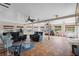 Large sunroom with tile flooring, ceiling fans, and many windows providing ample natural light at 408 S Winsome Ct, Lake Mary, FL 32746