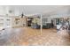 Expansive sunroom features tile flooring, ceiling fans, and abundant natural light from multiple windows at 408 S Winsome Ct, Lake Mary, FL 32746