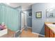 Bathroom featuring a shower, vanity with sink, and blue paint at 43825 State Road 19, Altoona, FL 32702