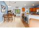 Open concept dining area leading to the kitchen and featuring a wooden table at 43825 State Road 19, Altoona, FL 32702