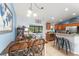 Open kitchen and dining area featuring stainless steel appliances and tile floors at 43825 State Road 19, Altoona, FL 32702