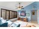 Bright living room with a fireplace, window shutters, and tile flooring at 43825 State Road 19, Altoona, FL 32702